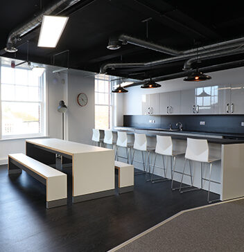 open plan kitchen area in modern office layout