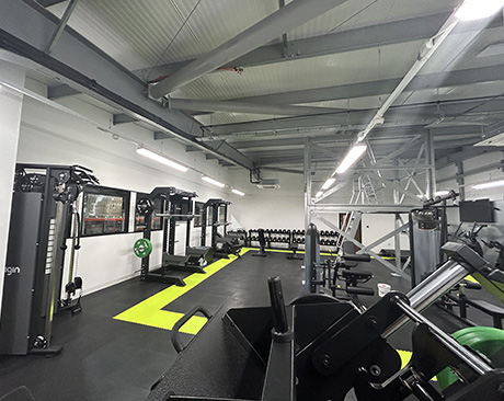  Well-equipped, spacious gym with weights and various exercise machines. - HBC Logistics